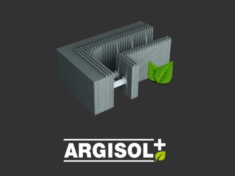 Edificio moderno con ampie vetrate immerso nel verde, simbolo di architettura sostenibile e innovativa.